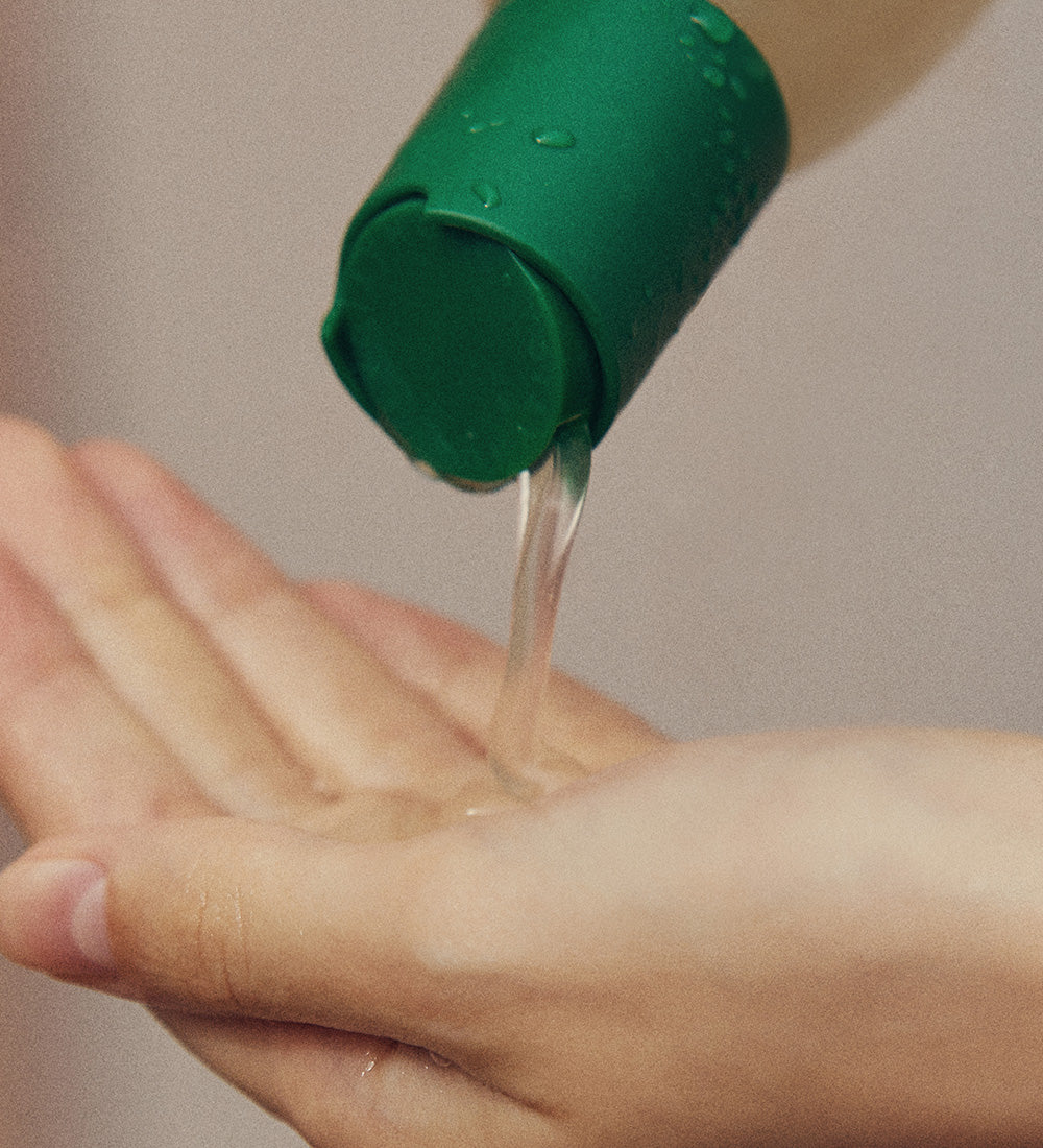 Official photograph of shampoo dispensed into a hand.